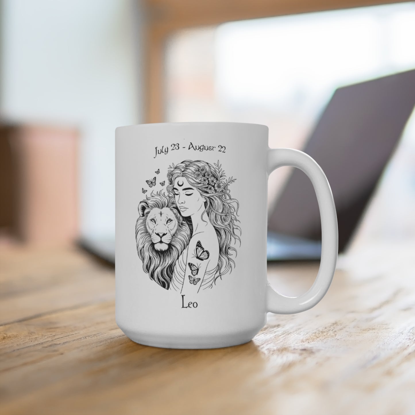 White mug with a black and white illustration of a woman with a lion and text on a wooden surface.