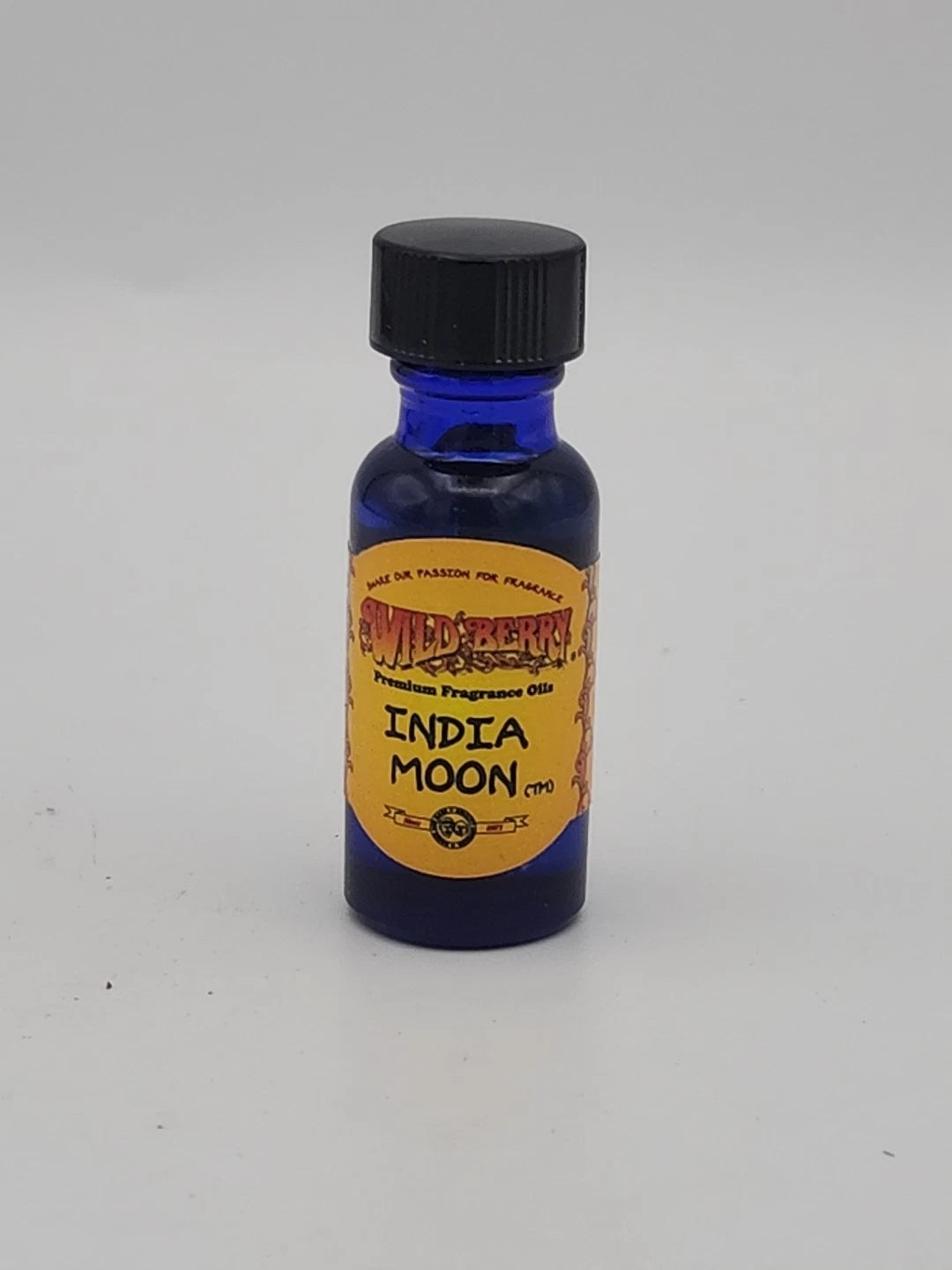 Blue bottle with a yellow label on a white background