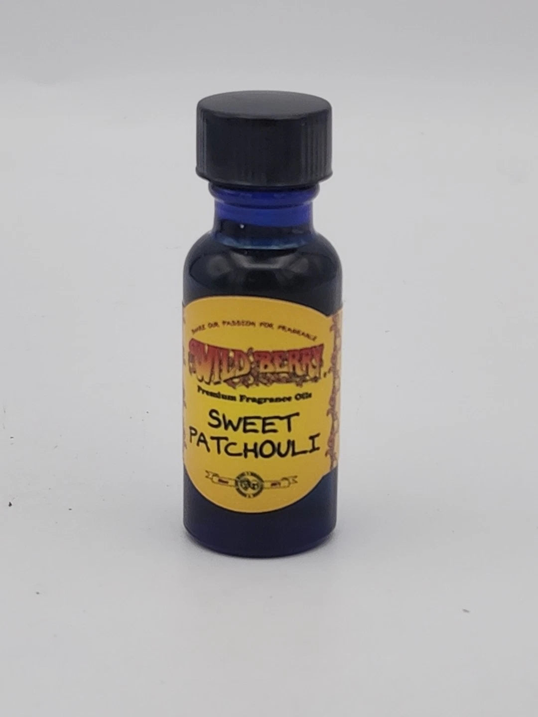 Bottle of Sweet Patchouli fragrance oil with a yellow label on a white background