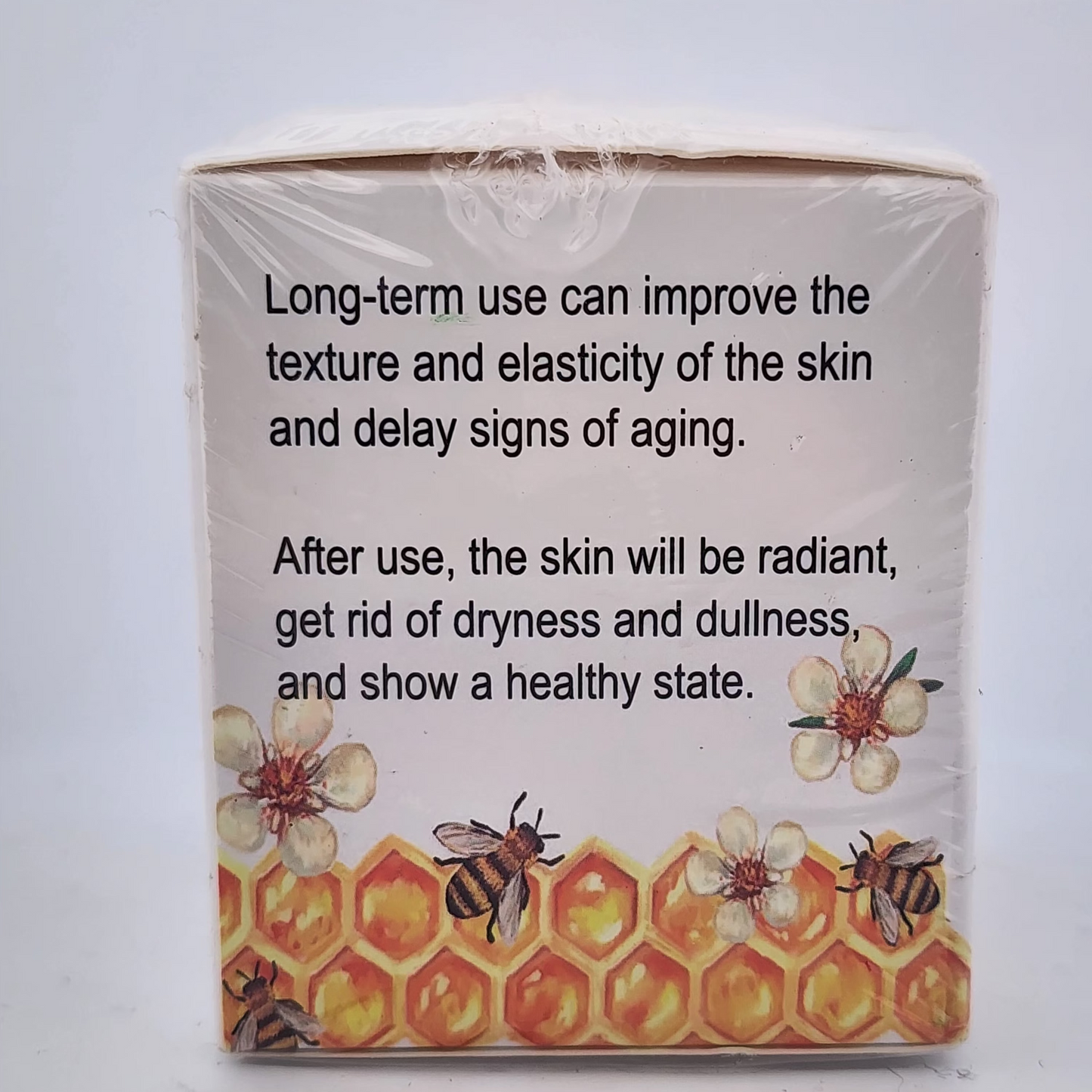 Product packaging with text about skin improvement and decorative elements on a white background