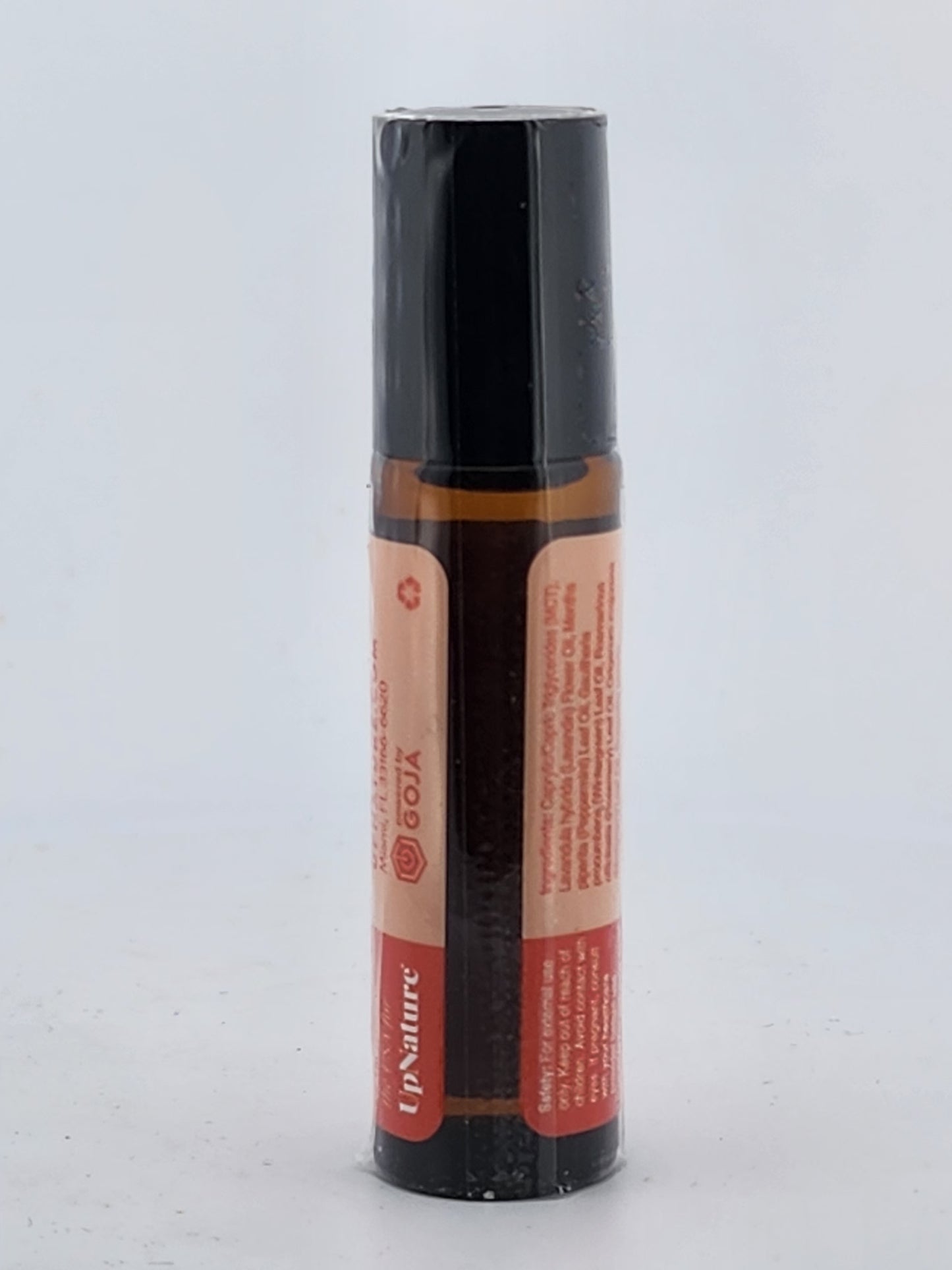 Roll-on bottle with black cap and red label on a white background