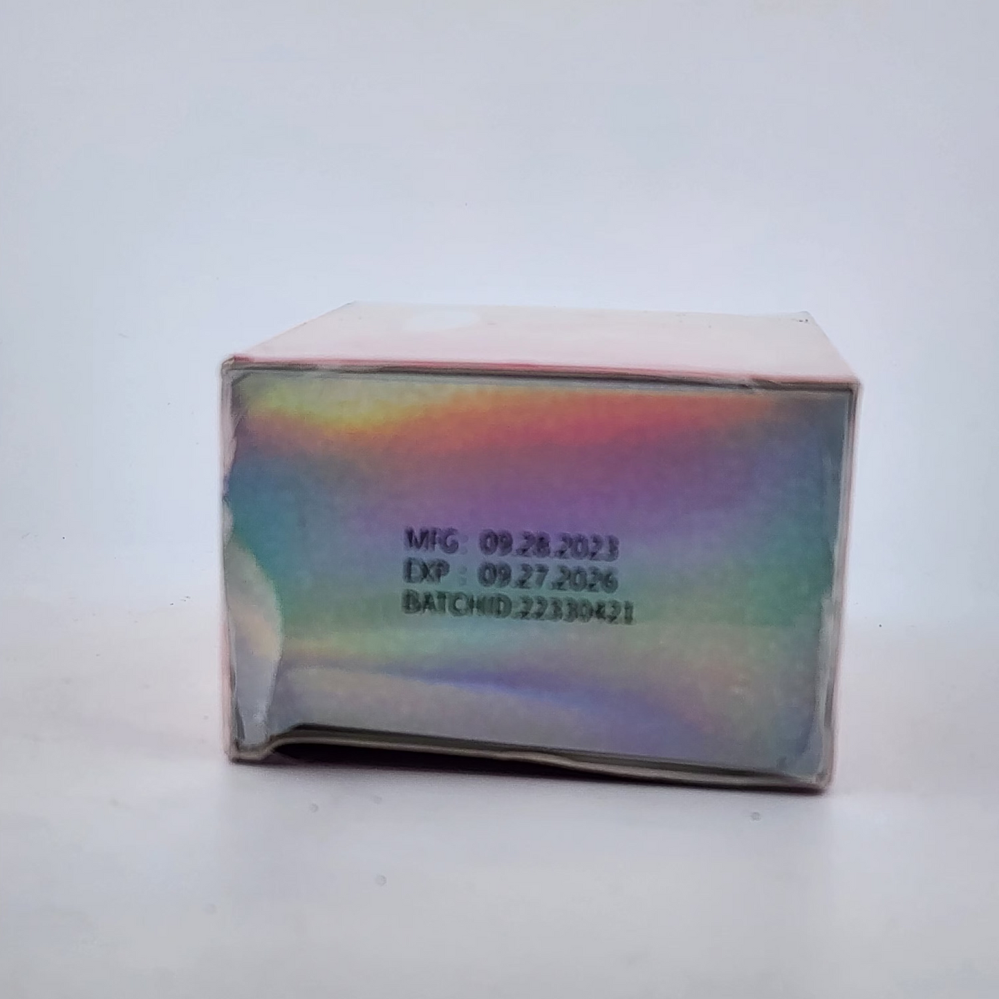 Iridescent box with text on a white background