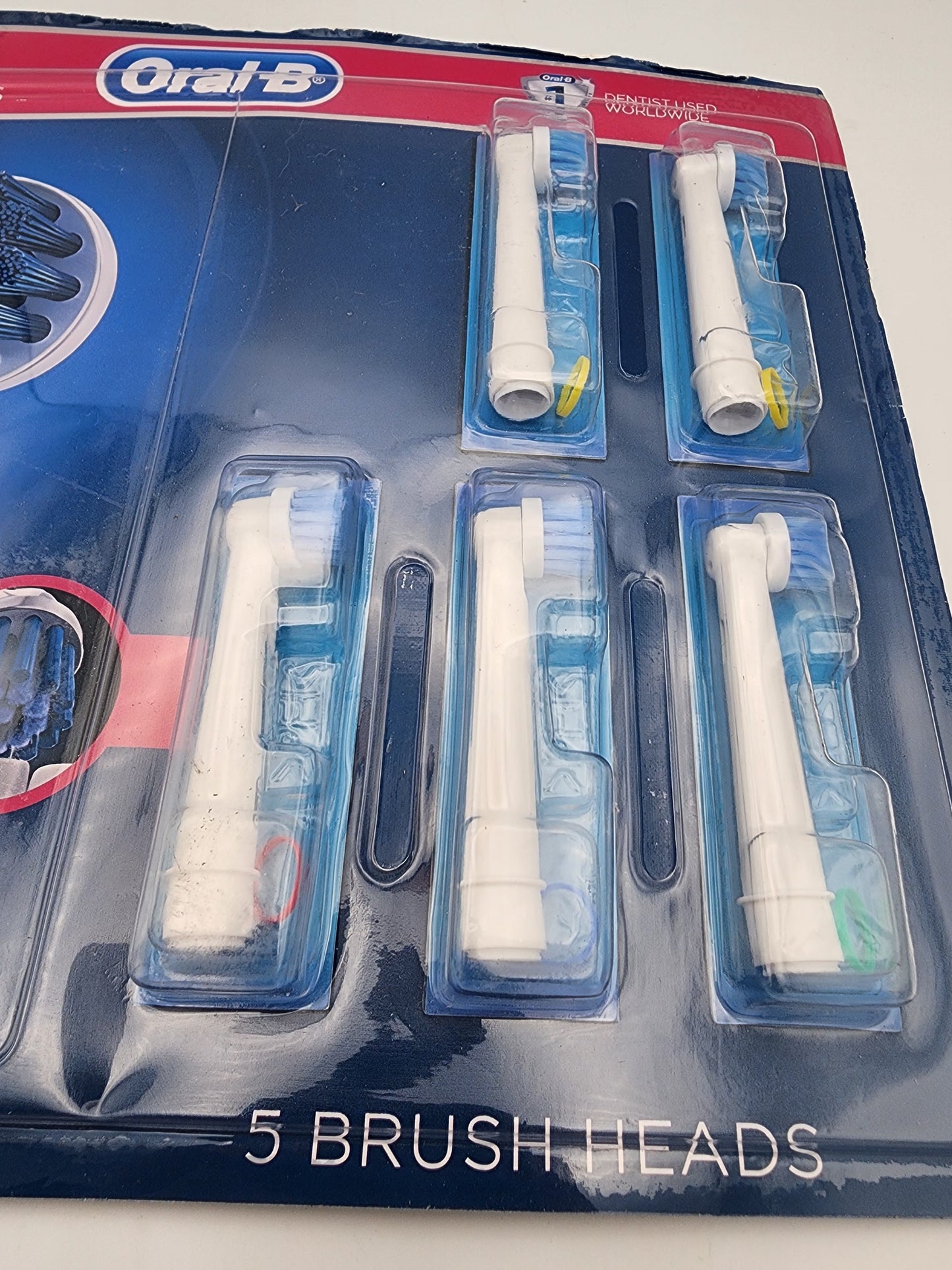 Packaging of Oral-B toothbrush heads with visible branding on a white background