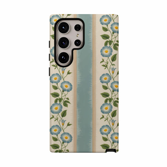 Phone case with blue floral pattern on striped background.
