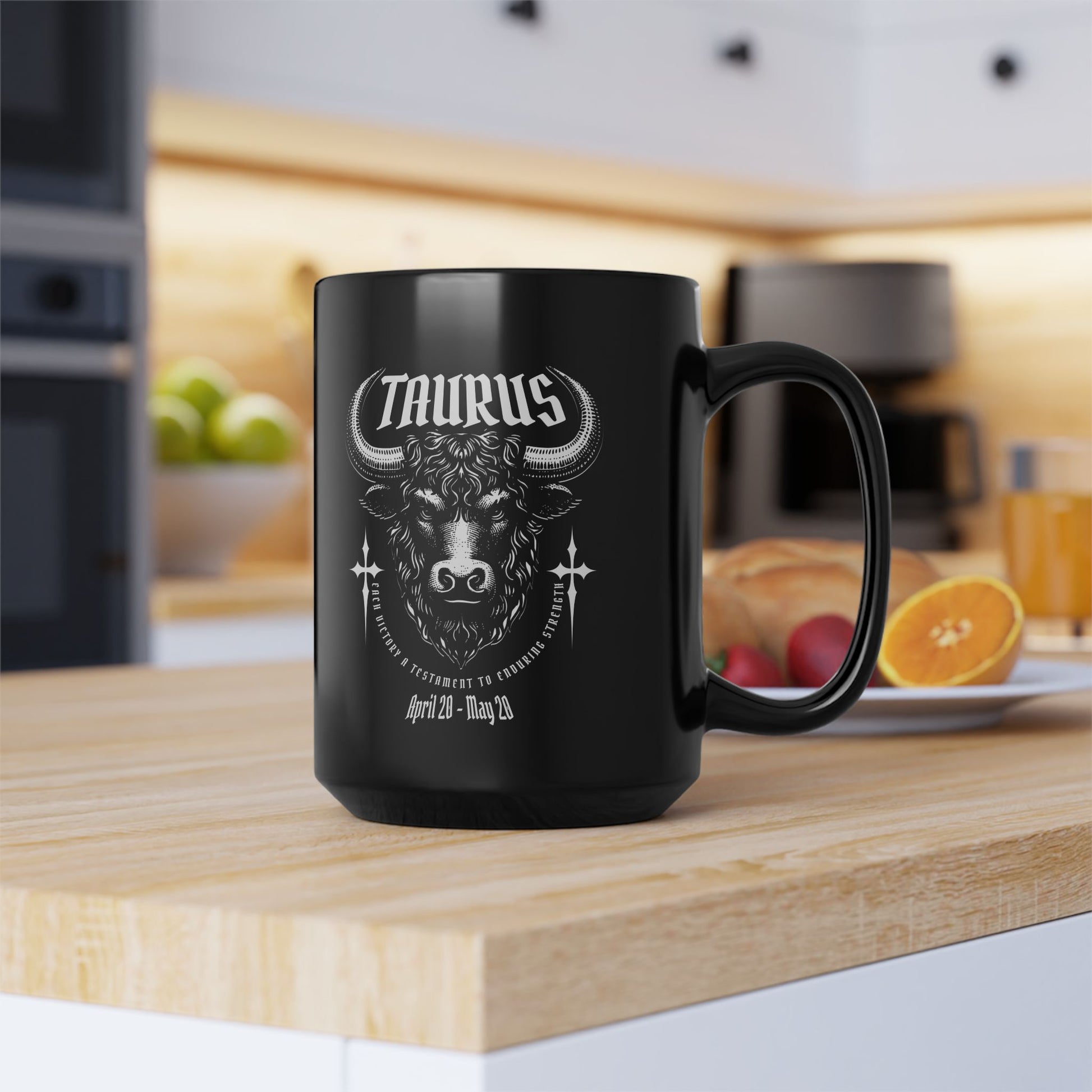 Black mug with Taurus zodiac design on a kitchen counter