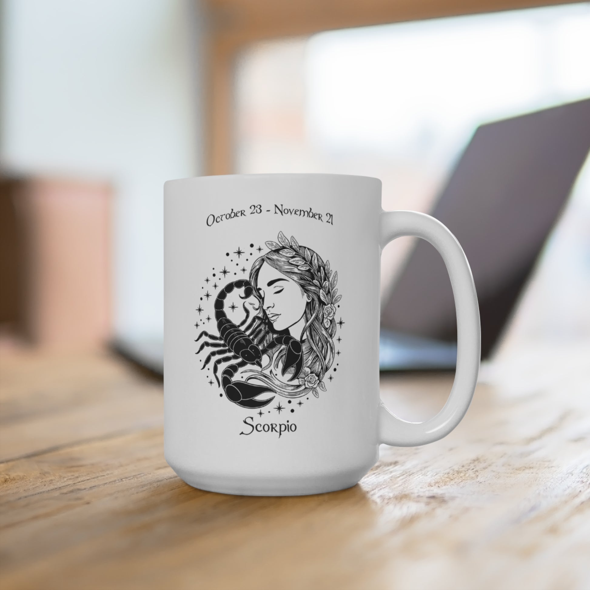 White mug with Scorpio zodiac design on a wooden surface
