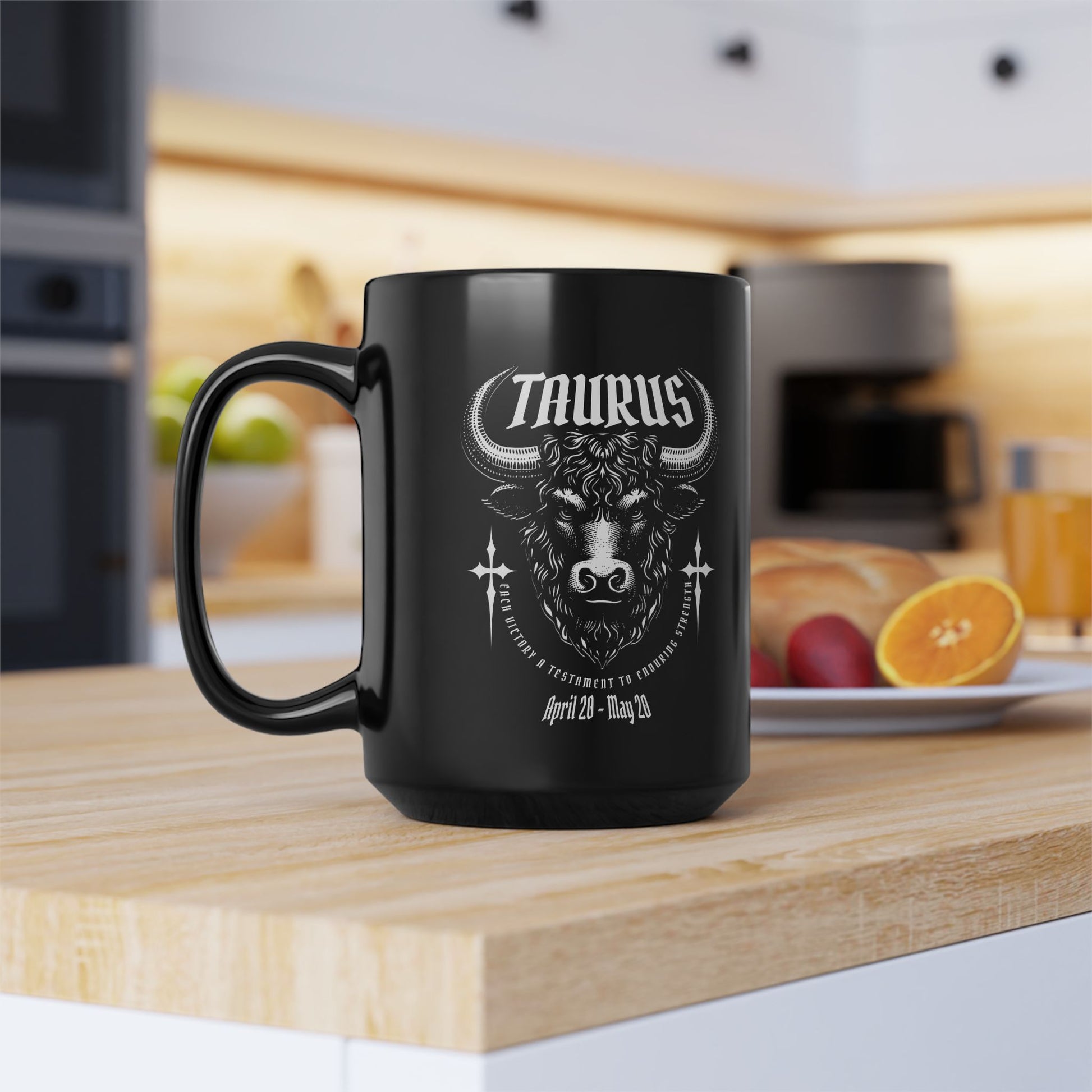 Black mug with Taurus design on a kitchen counter
