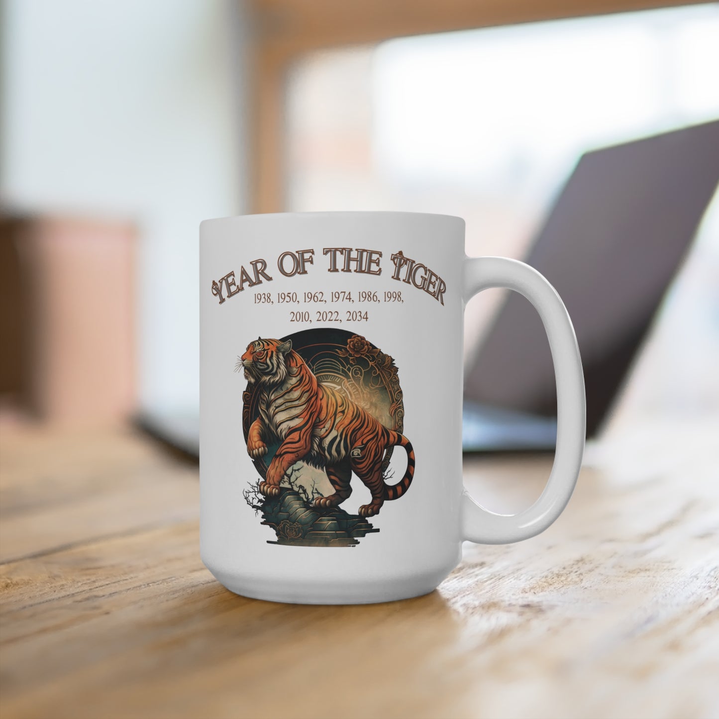 White mug with a tiger design and 'Year of the Tiger' text on a wooden surface.