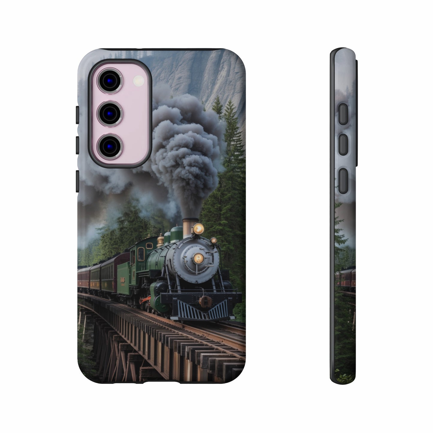 Green steam train crossing wooden bridge with mountain and forest background.