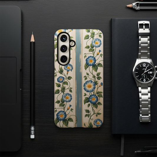 Floral patterned phone case with blue flowers on a wooden background.