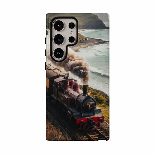 Red steam train travels along coastal tracks with ocean and cliffs.