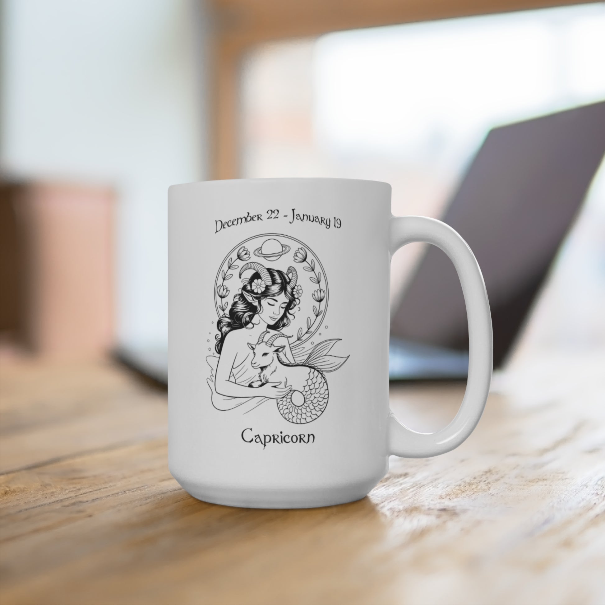 White mug with Capricorn zodiac design on a wooden surface