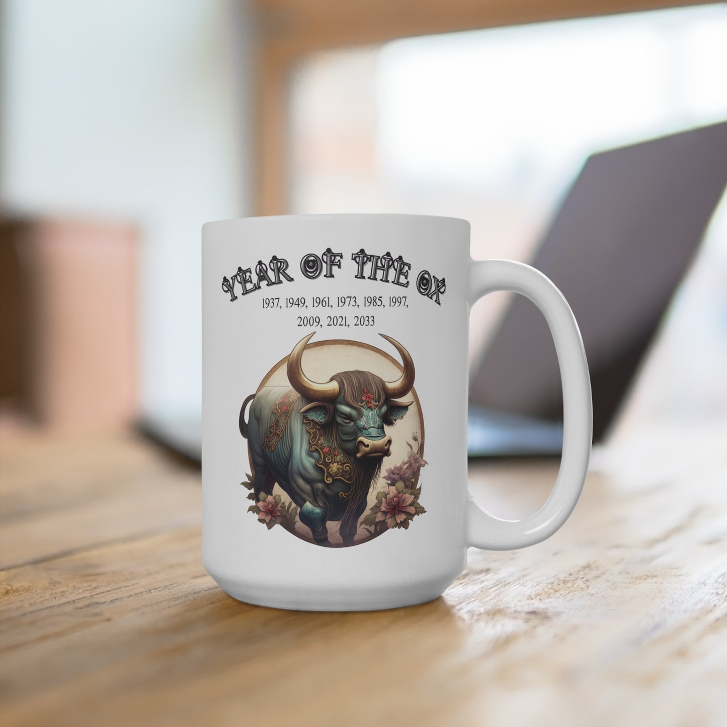 White mug with bull design and text on a wooden surface