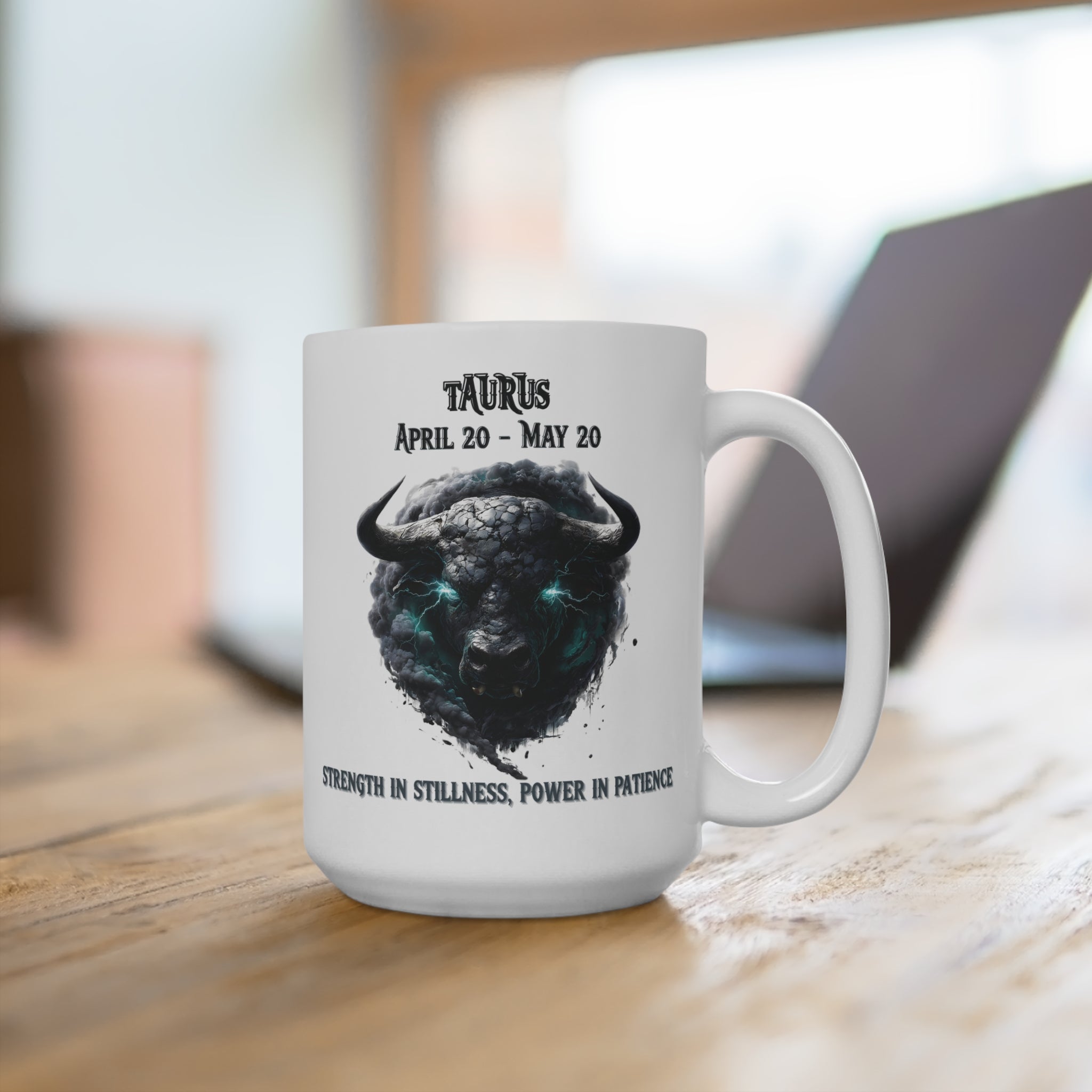 White mug with Taurus zodiac design on a wooden surface