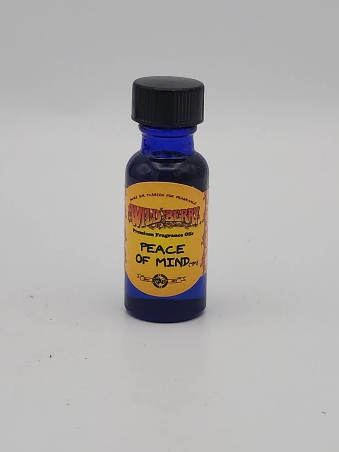 Small blue bottle with a yellow label on a white background