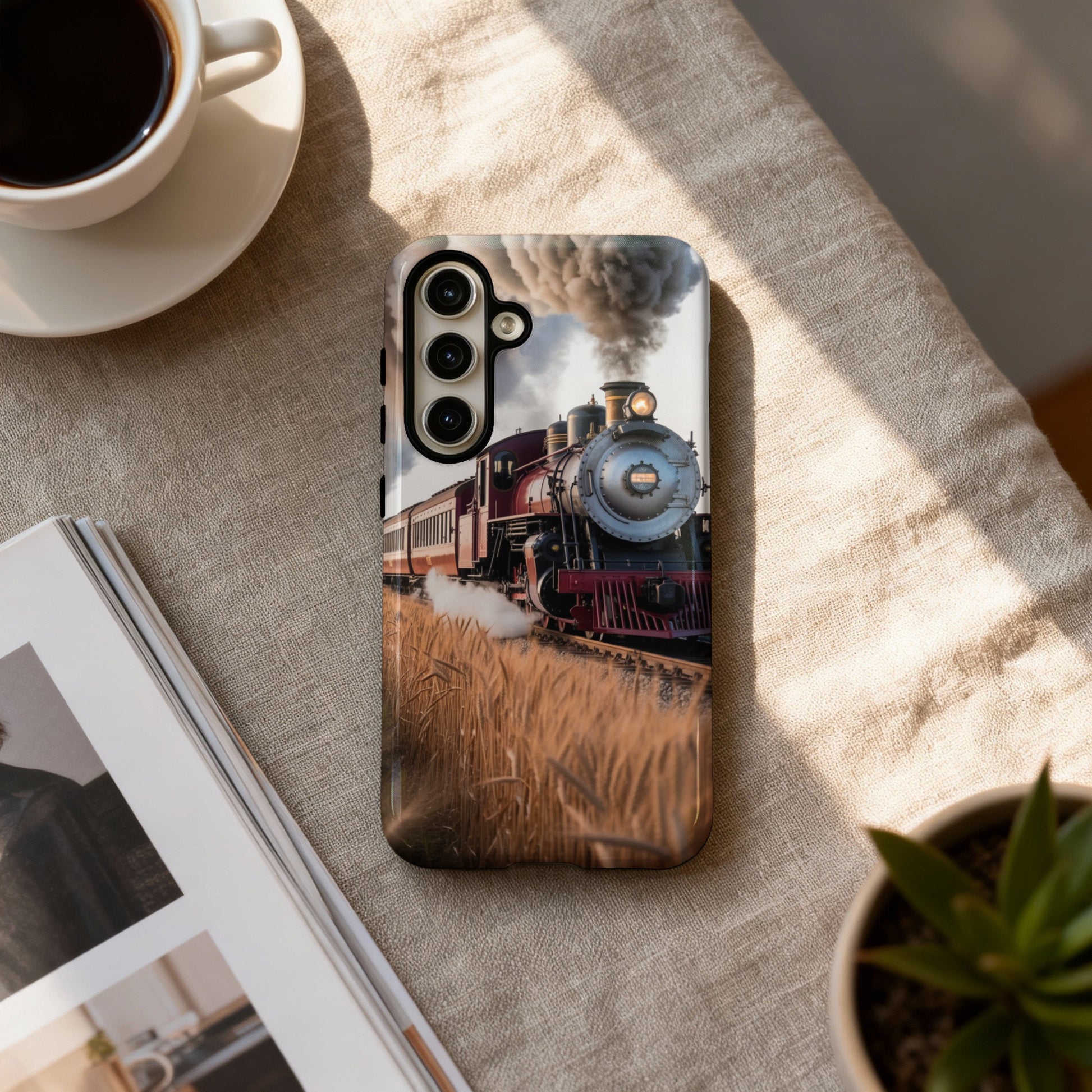 Phone case with a steam train passing through a wheat field.