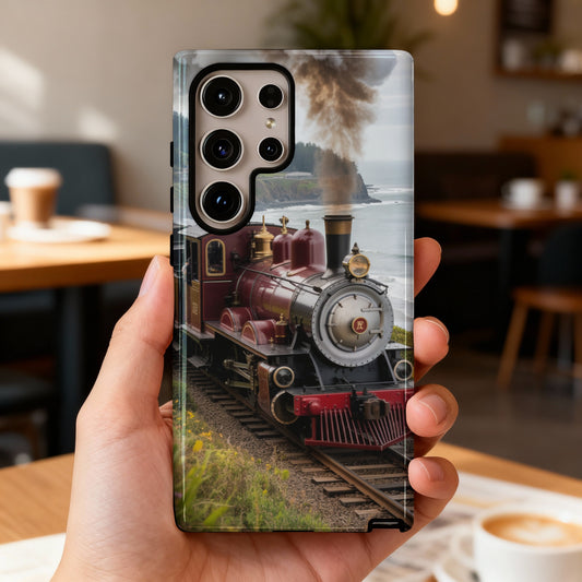 Red steam train on tracks with ocean and smoke in background.