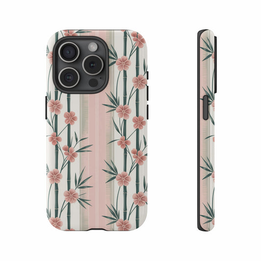 Phone case with pink flowers and bamboo on a striped background.