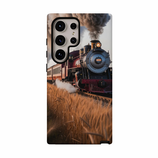 Vintage steam train with red cars chugs through a wheat field.