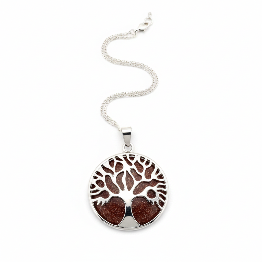 Top-down view of Tree of Life goldstone pendant showing circular stone with glittering copper and intricate silver branches