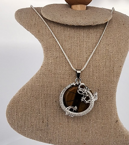 Necklace with a round pendant on a mannequin bust