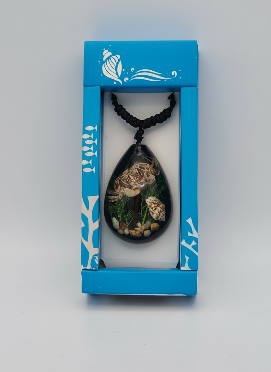 Sea turtle pendant necklace in ocean-themed turquoise gift box with resin jewelry