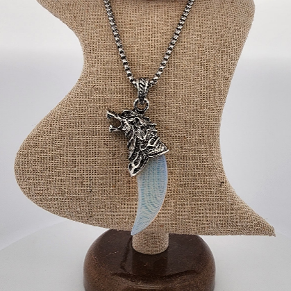 Necklace with a pendant on a mannequin bust against a white background