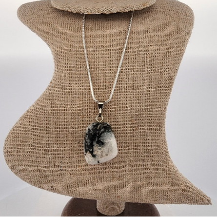 Necklace with a pendant on a mannequin bust