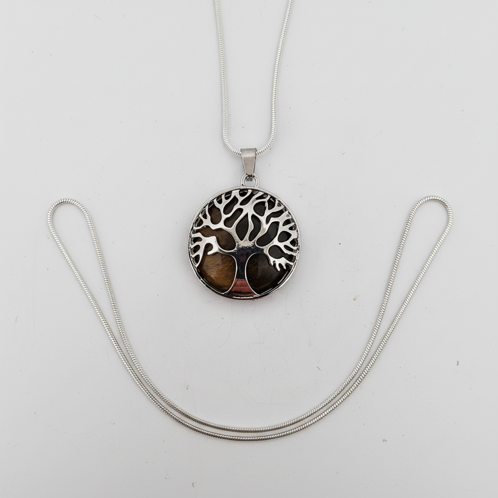 Top-down view of Tree of Life tiger eye pendant showing circular stone with natural chatoyant bands and intricate silver branches