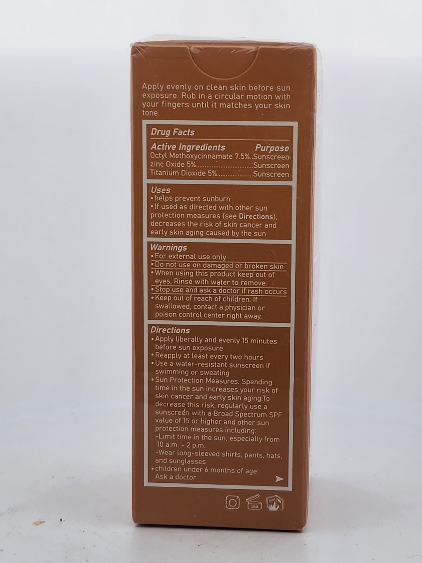 Back of a sunscreen packaging with text and product details on a white background