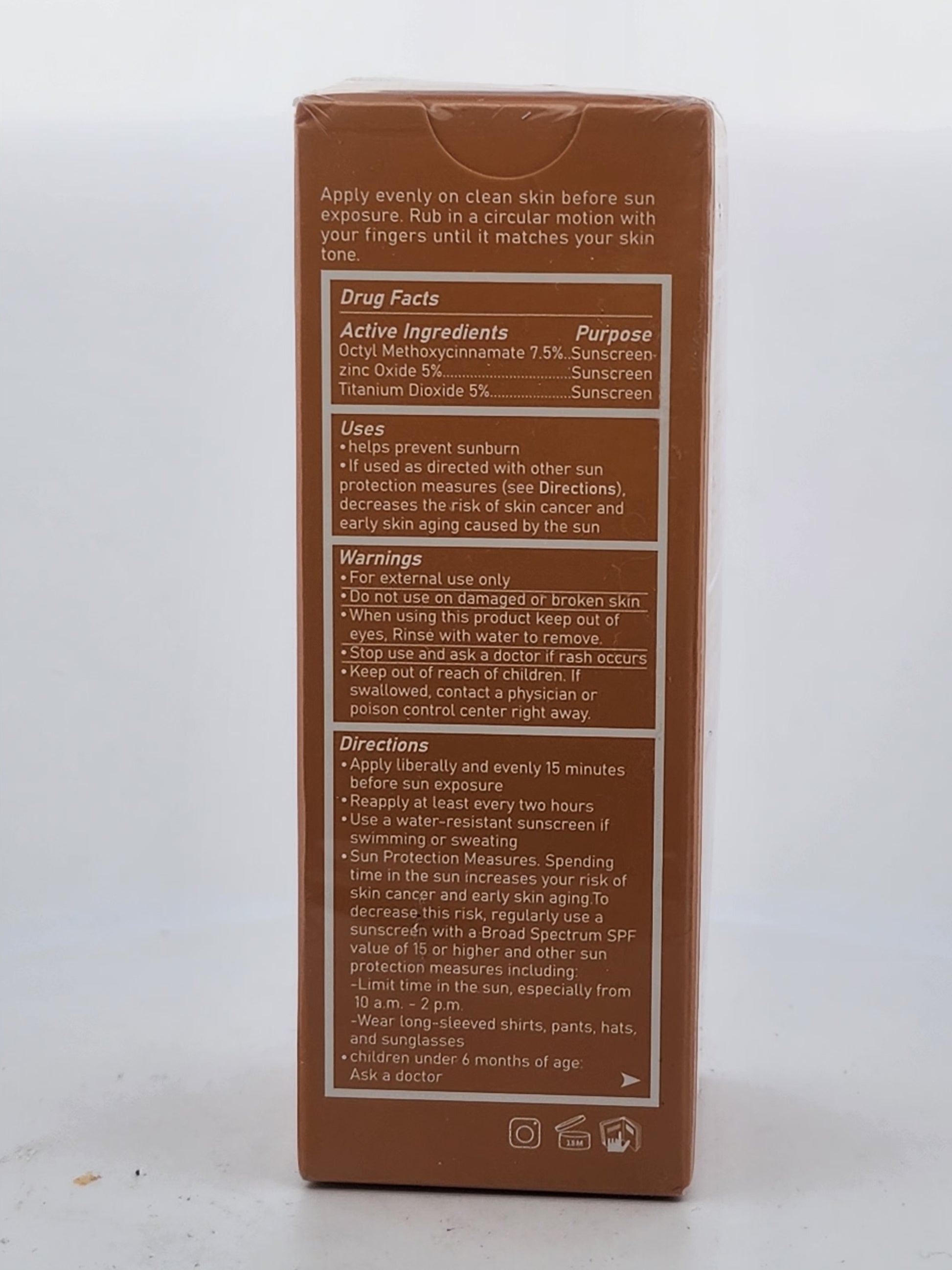 Back of a sunscreen packaging with text and product details on a white background