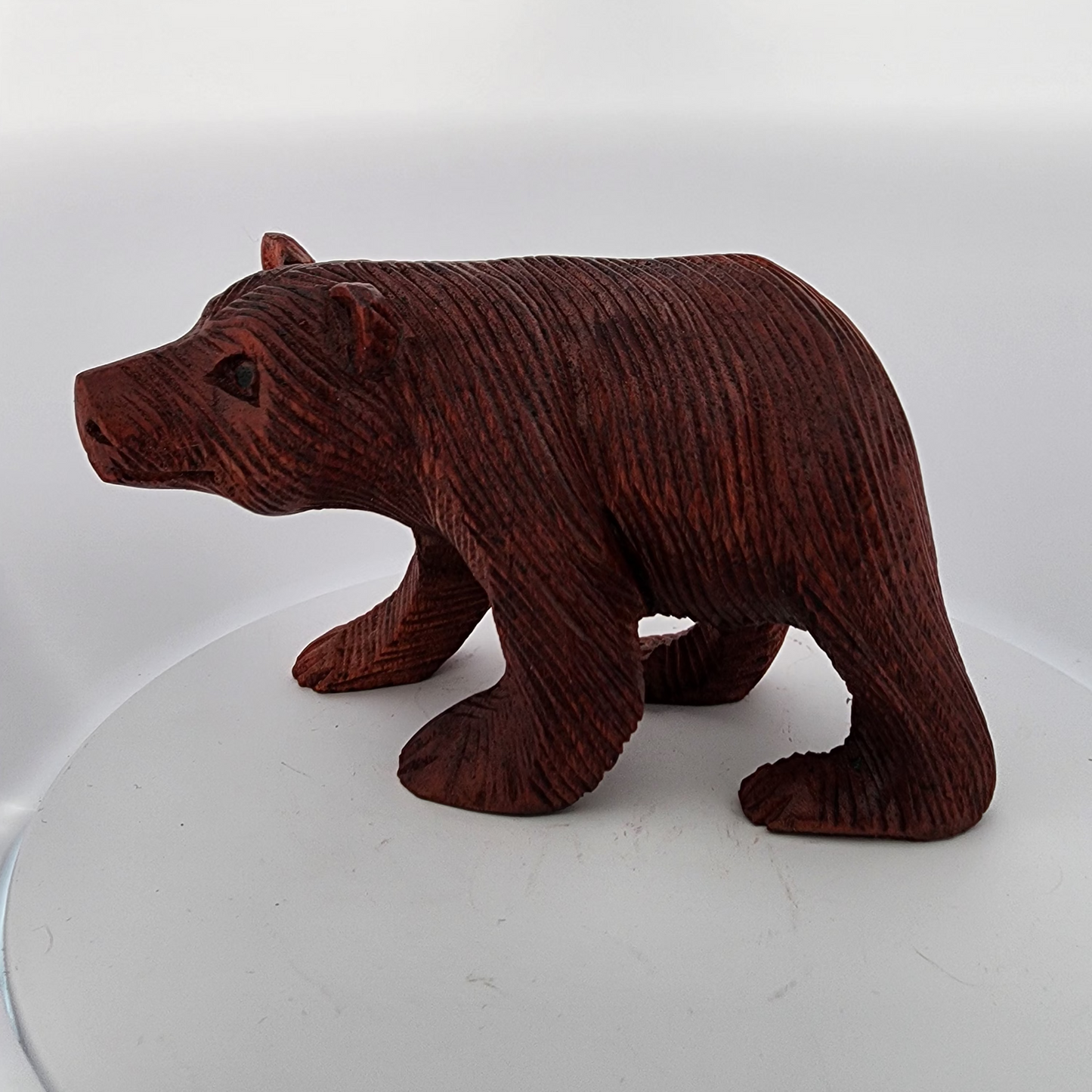 Brown bear figurine on a white background