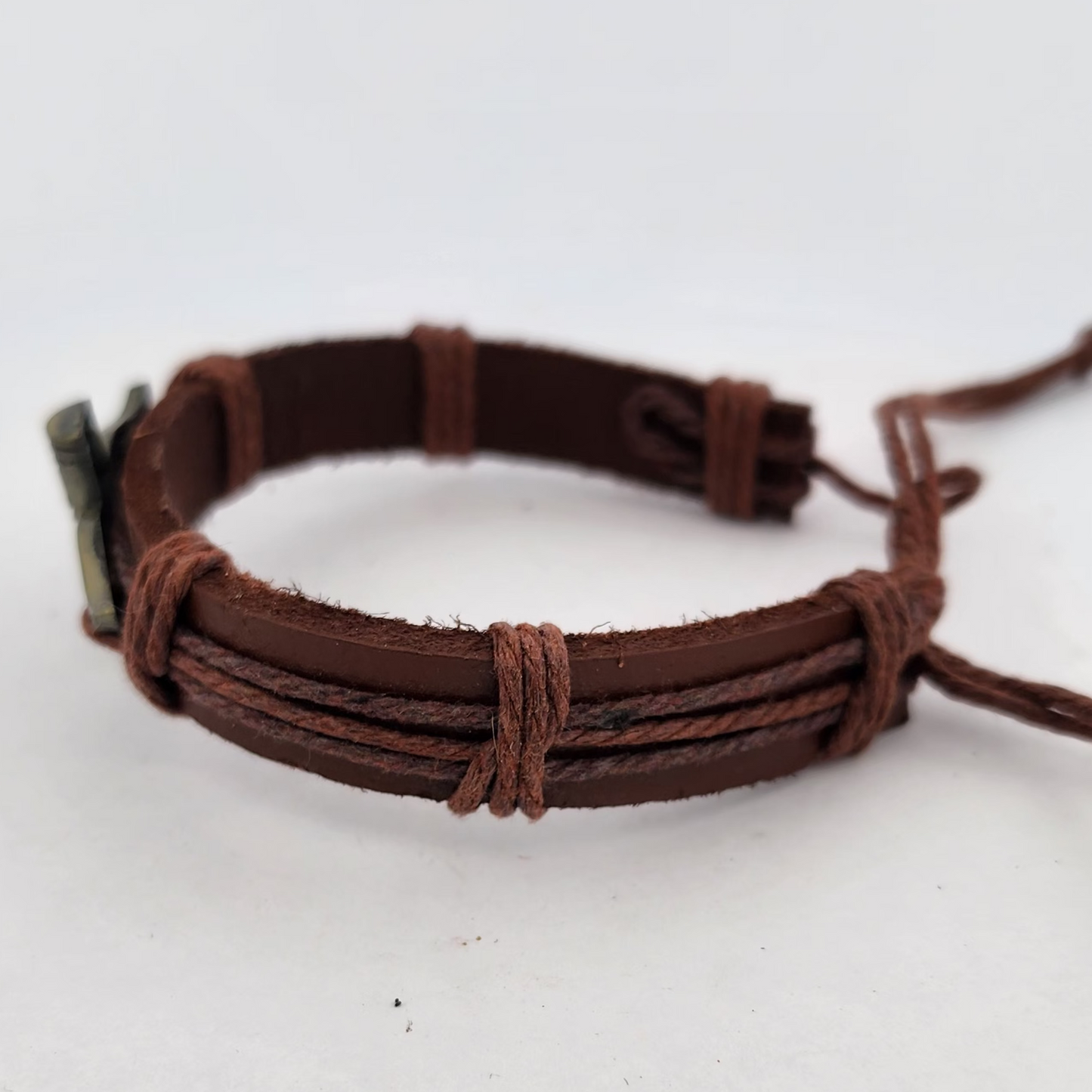 Brown leather bracelet on a white surface