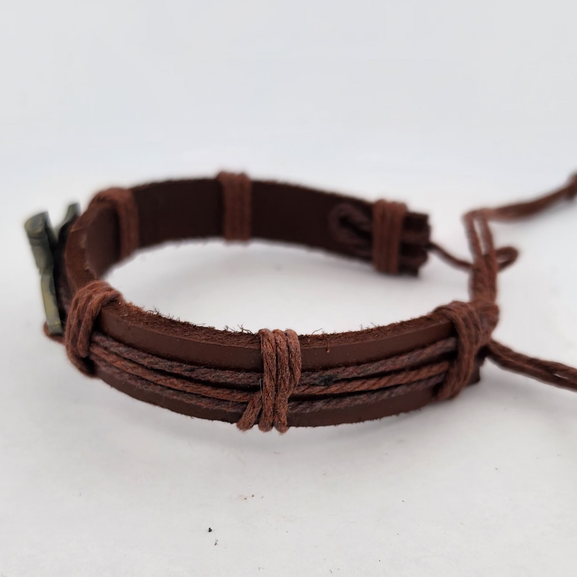 Brown leather bracelet on a white surface