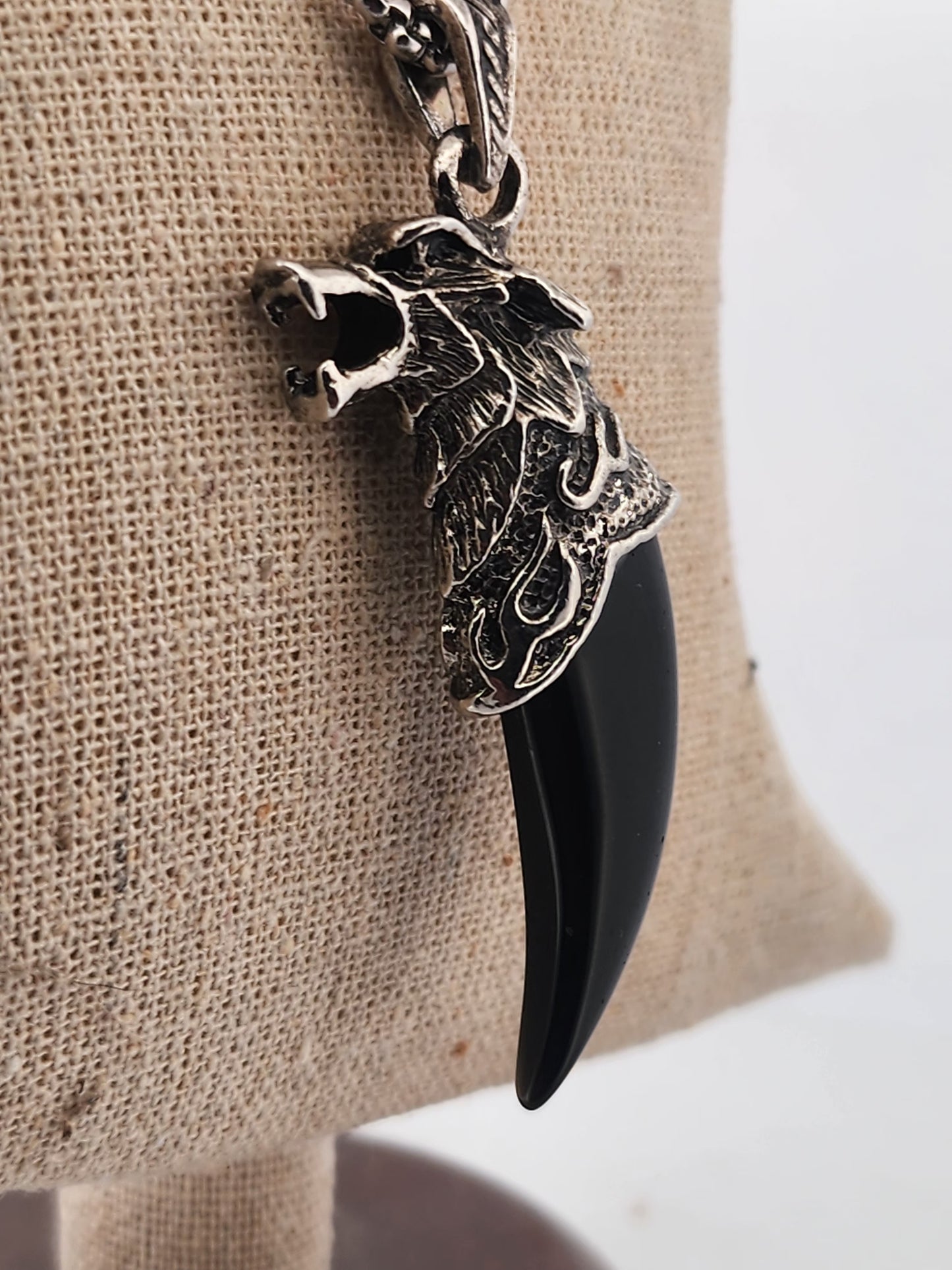 Necklace with a pendant on a mannequin bust against a white background