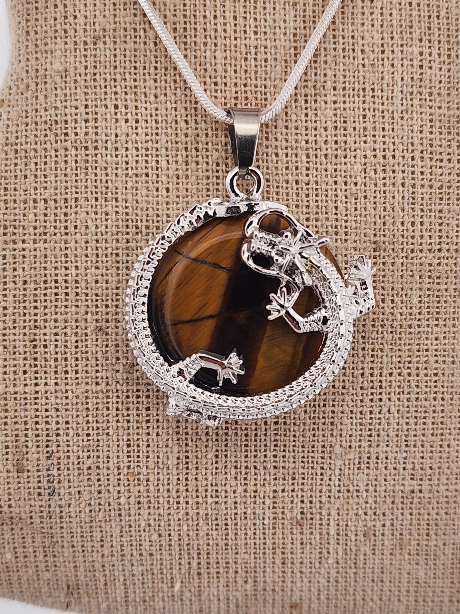 Necklace with a pendant on a mannequin bust against a white background