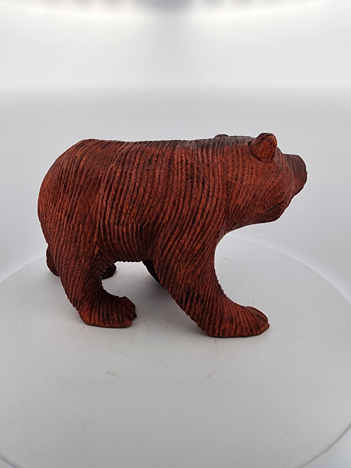 Brown bear figurine on a white background