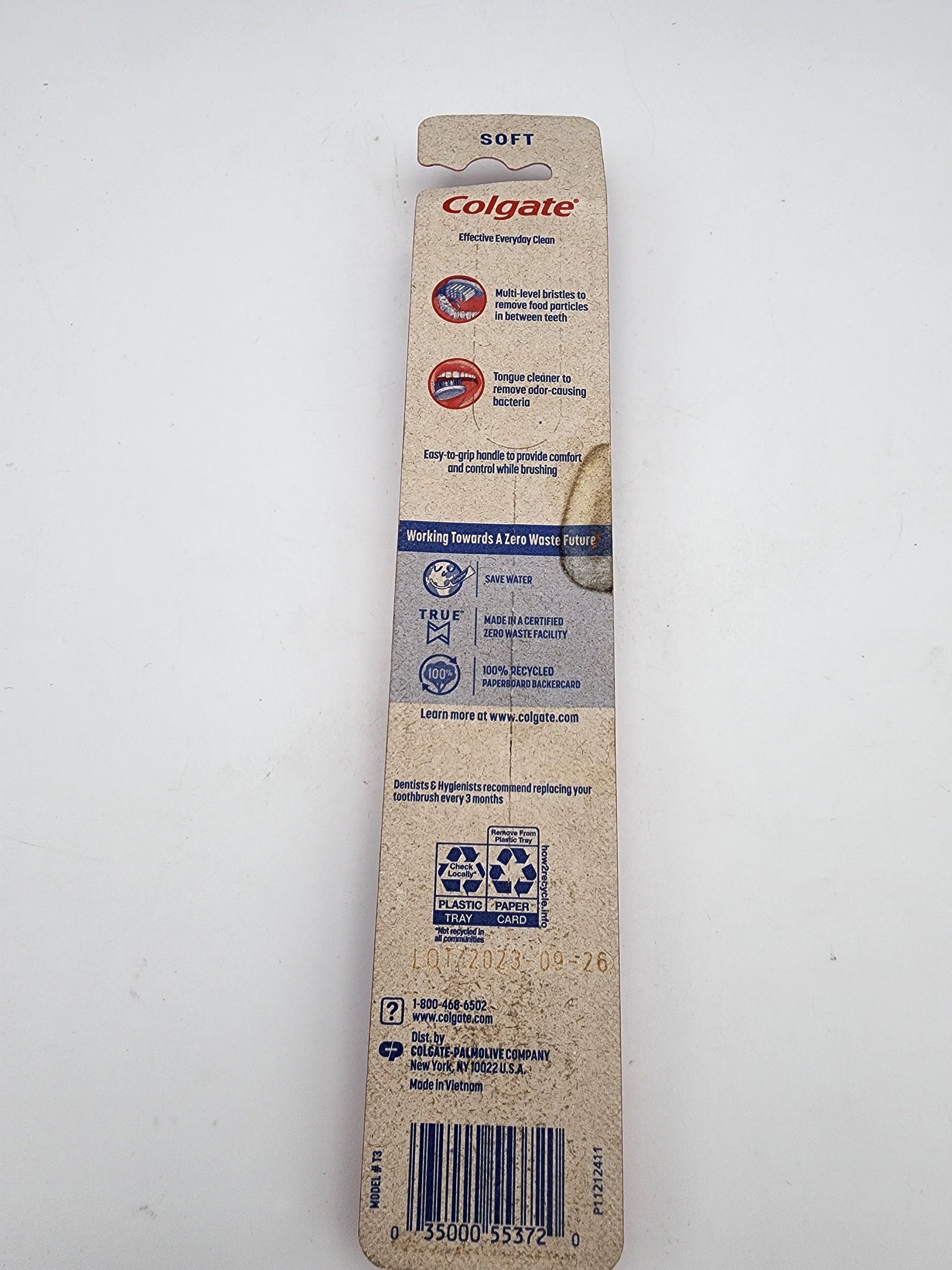 Colgate toothbrush packaging on a white background