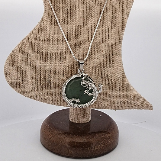 Necklace with a green pendant on a mannequin bust
