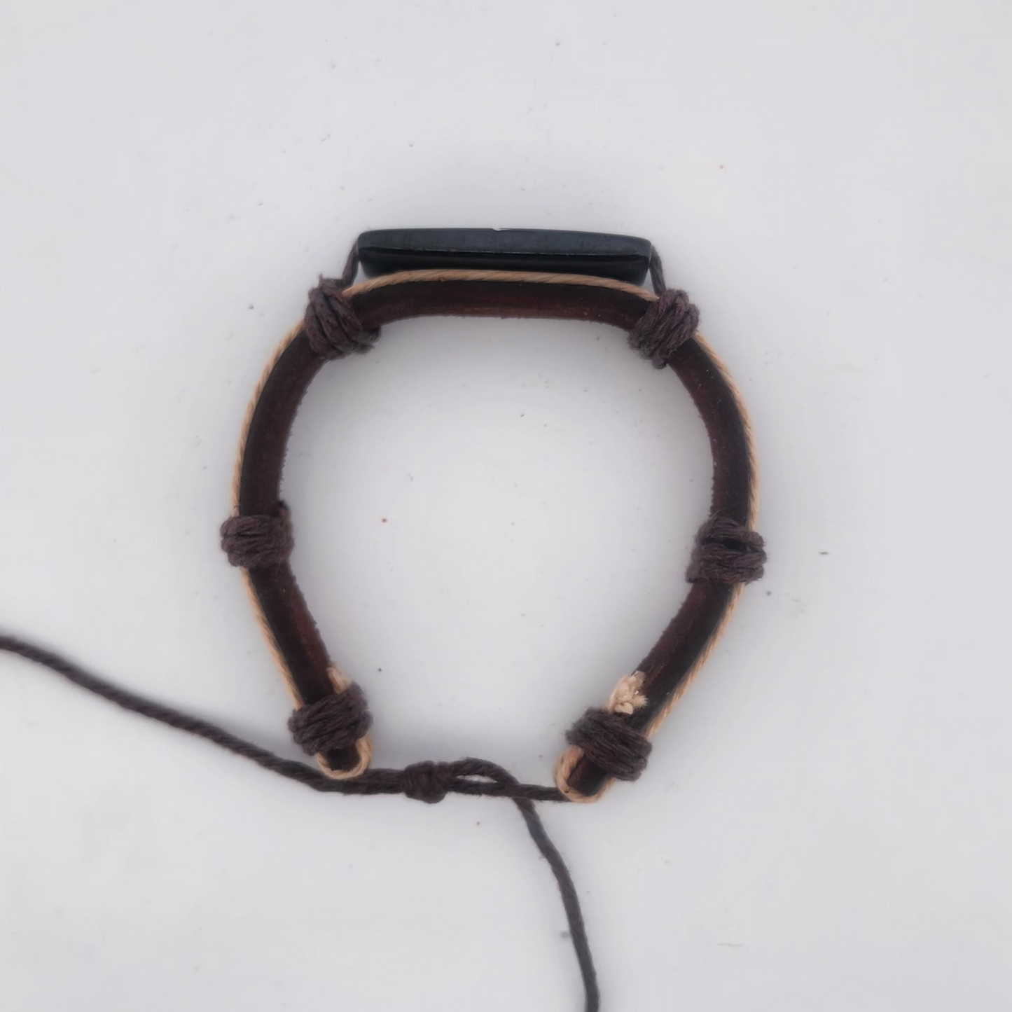 Bracelet with a black stone on a white background