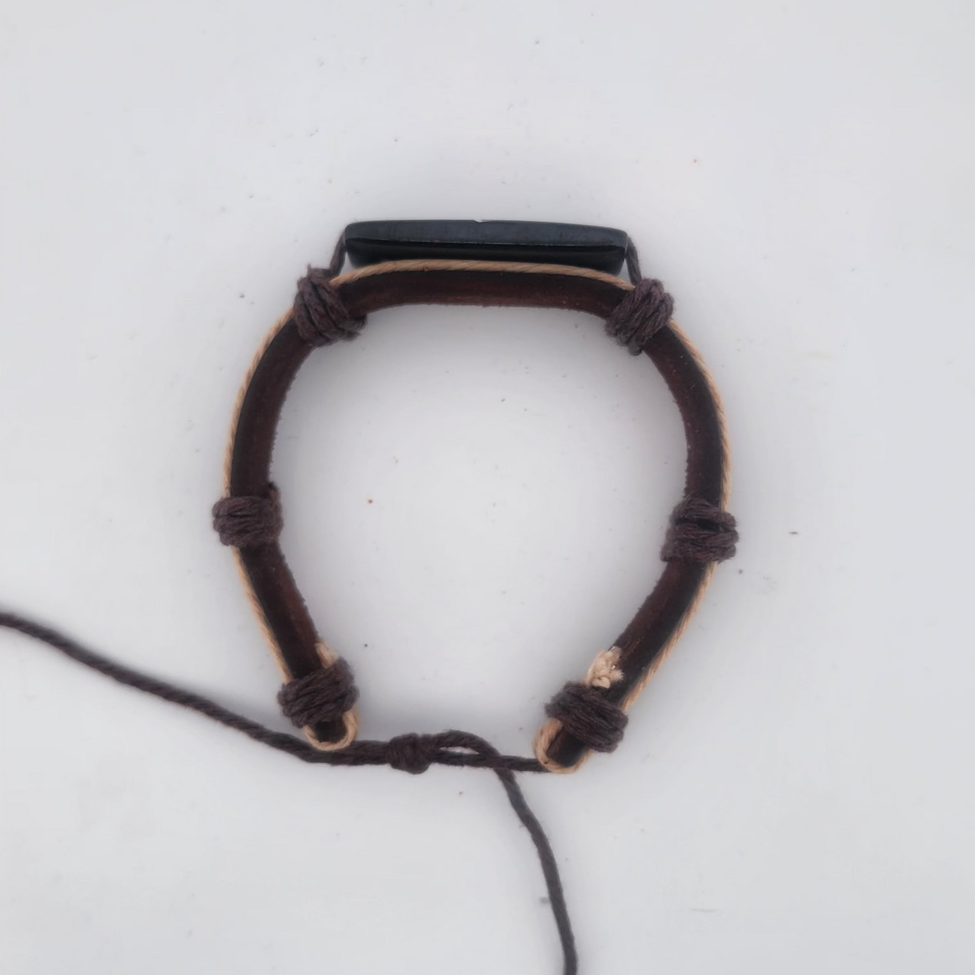 Bracelet with a black stone on a white background