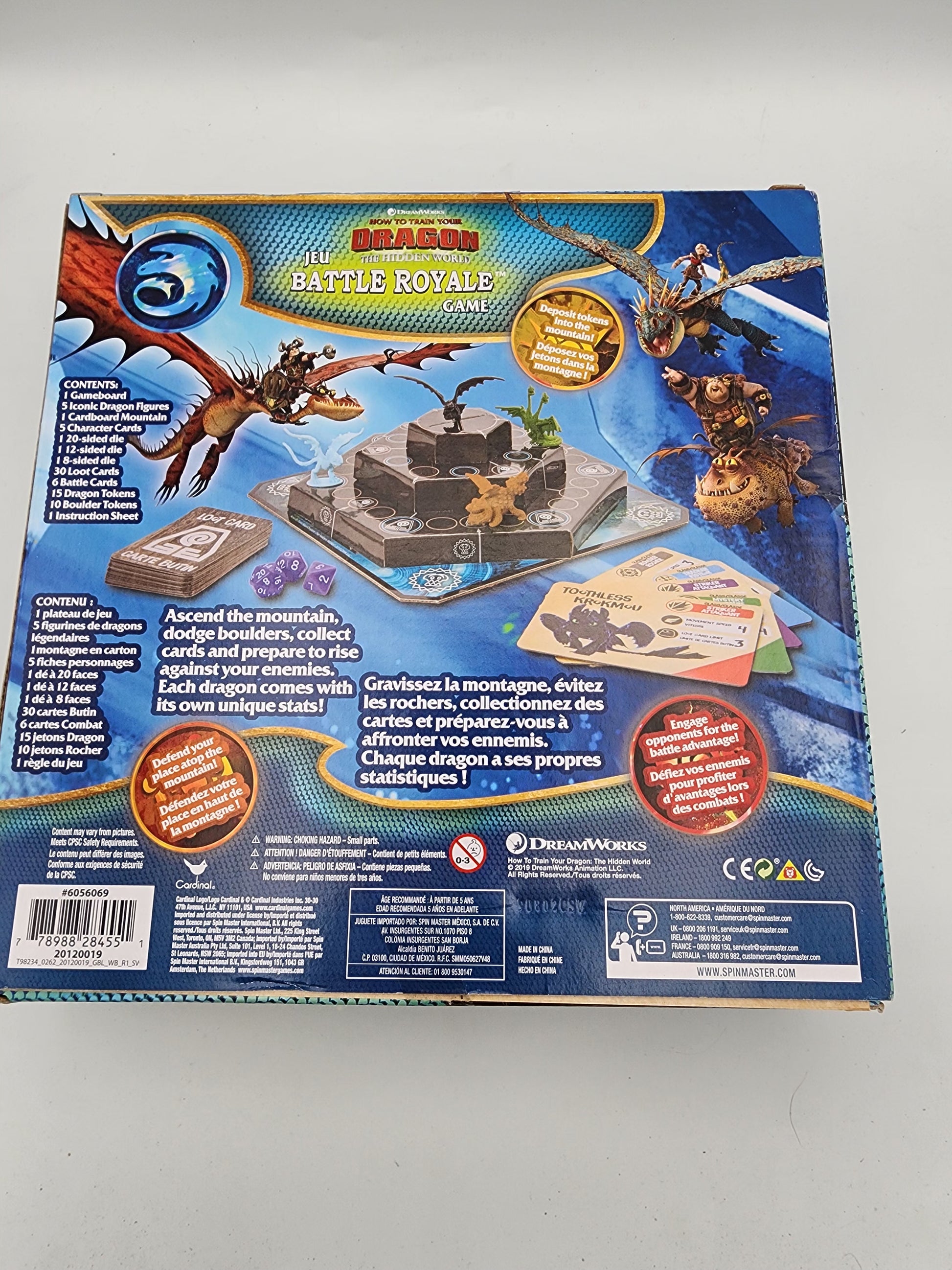 Back view of a 'Dragons Battle Royale' game box with dragon illustrations and text.