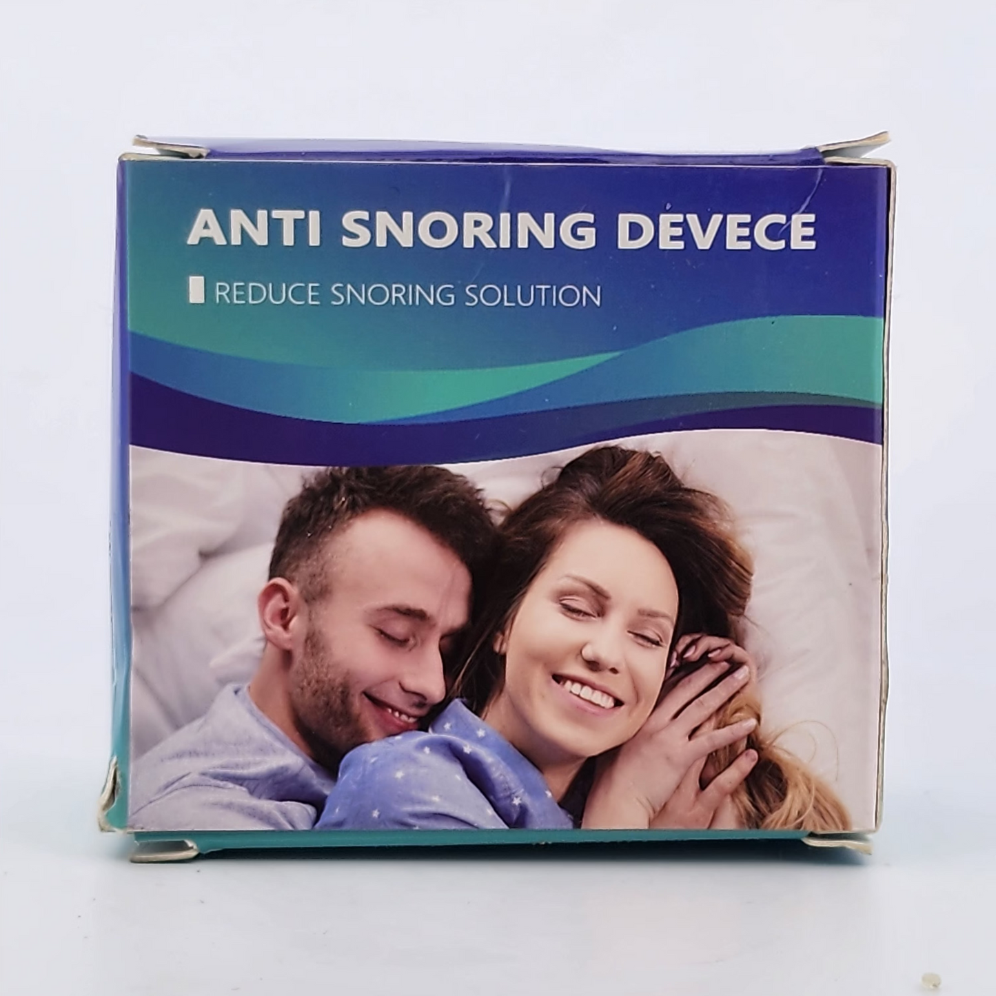Anti snoring device packaging with a couple on a white background