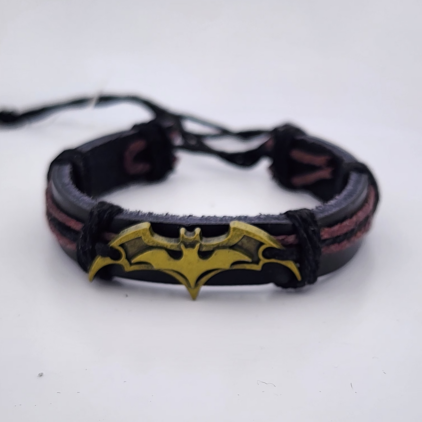 Bracelet with bat symbol on a white background