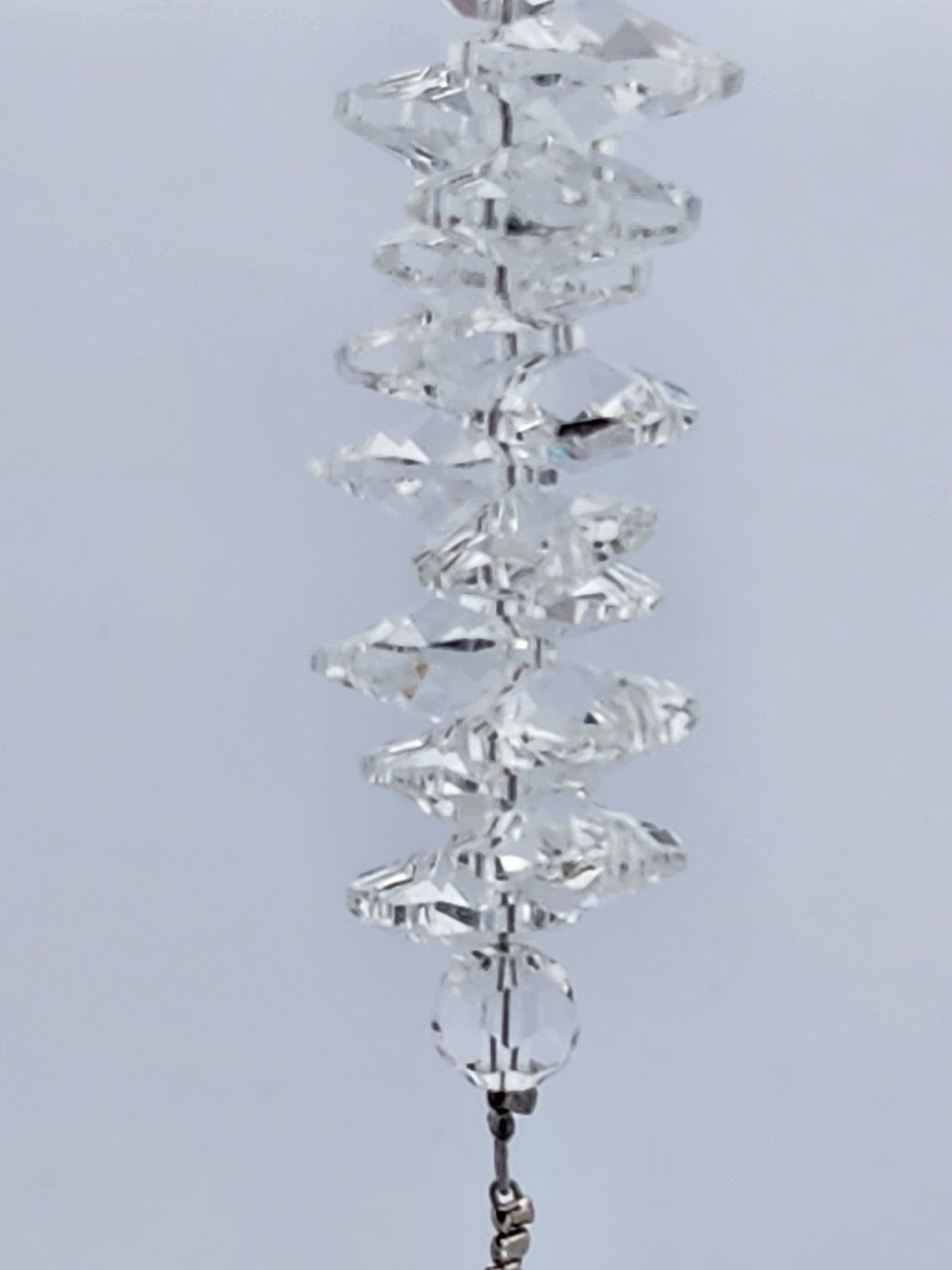 Crystal decorative item on a light gray background