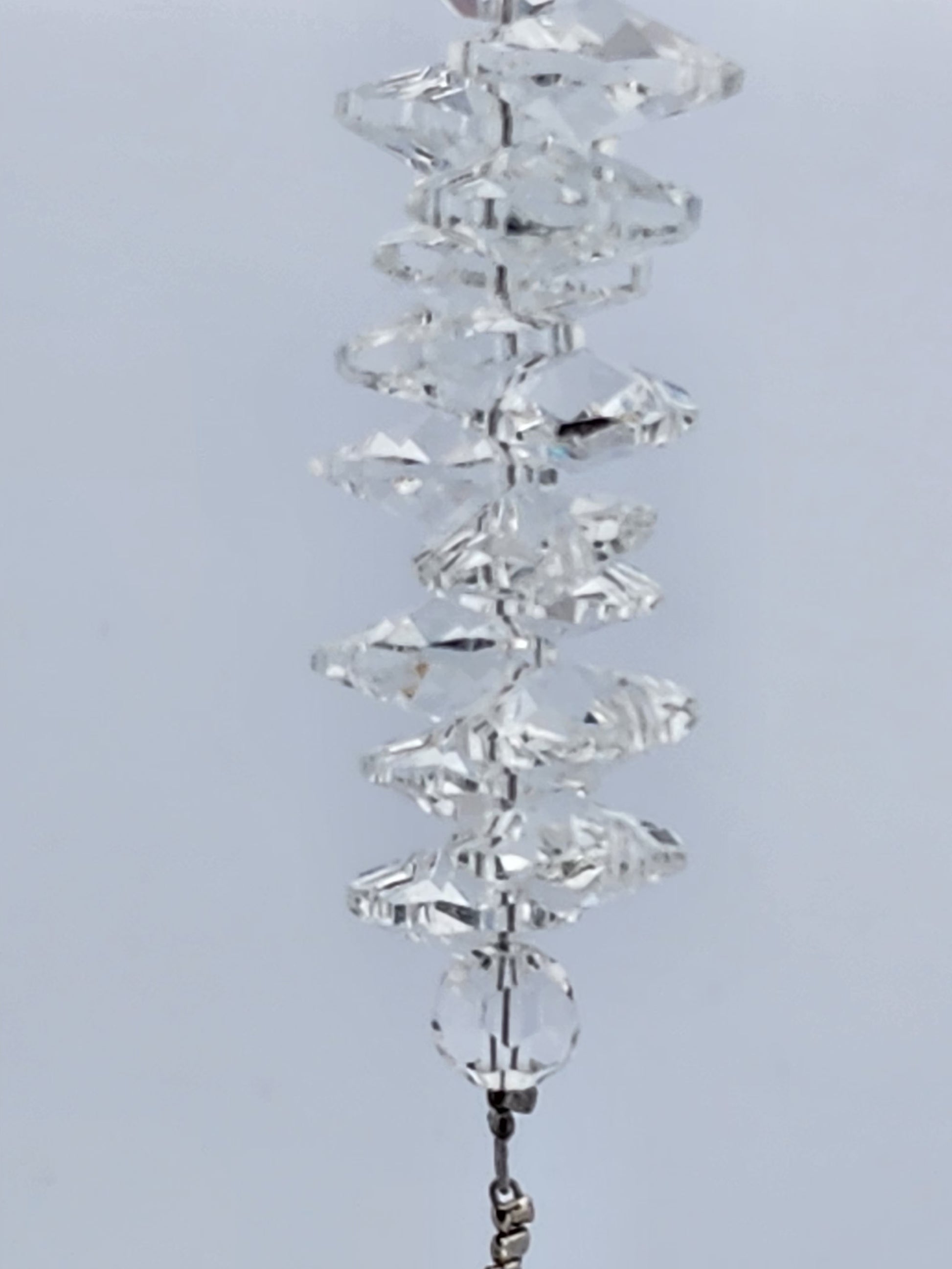 Crystal decorative item on a light gray background