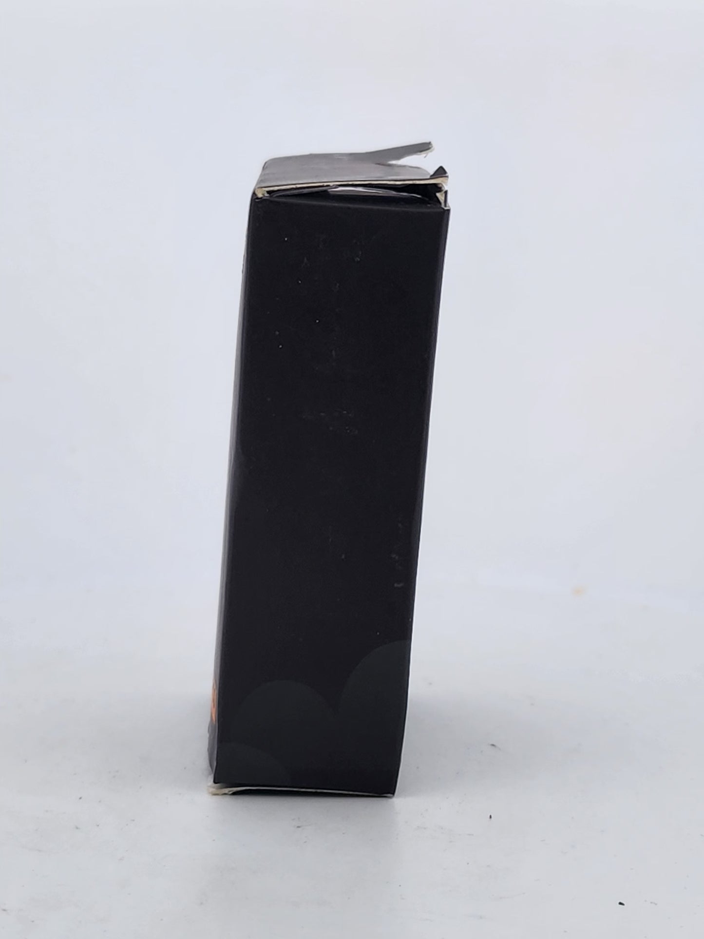Black rectangular box with a silver lid on a white background