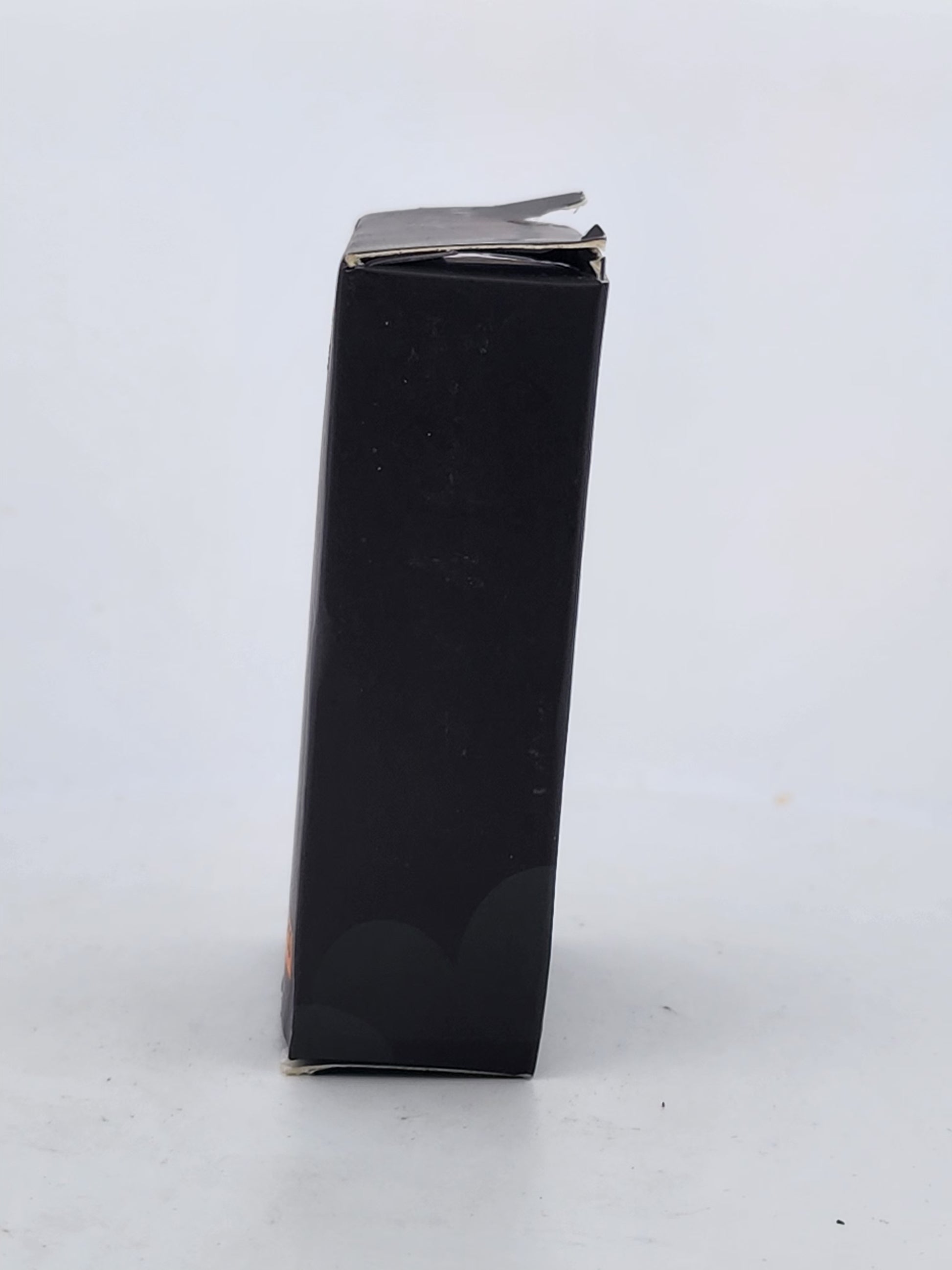 Black rectangular box with a silver lid on a white background