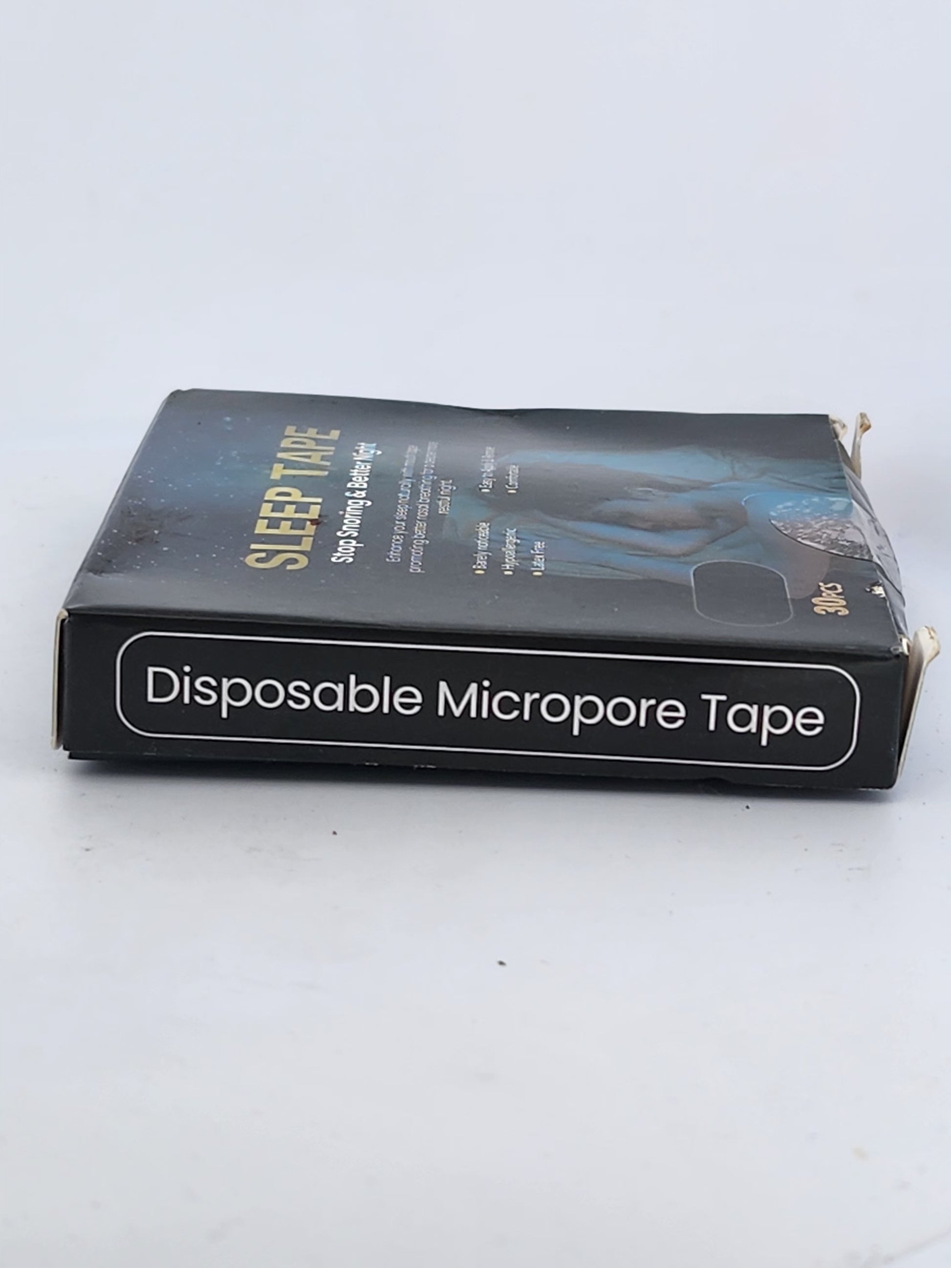 Box of disposable micropore tape with visible branding on a white background