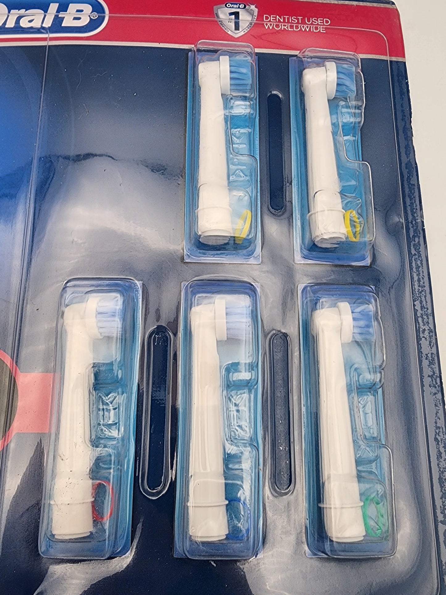 Oral-B toothbrush heads in packaging on a white background